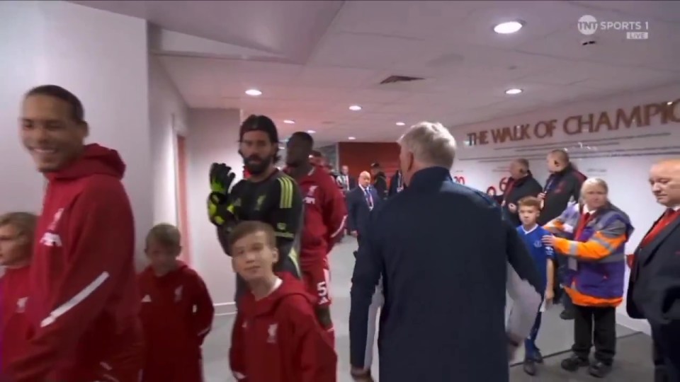 David Moyes argues with the referee in the tunnel before a football match.