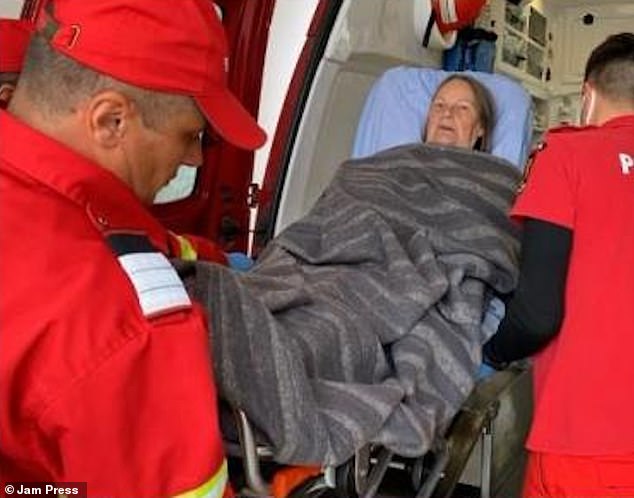 Moira Gallacher (pictured) was rushed to a nearby hospital and told local reporters her arm was 'sore'
