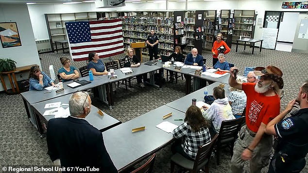 Bodnar, known online as the 'Truth-slinger' and followed by tens of thousands on social media, repeatedly disrupted the meeting, accusing the district of allowing 'communist propaganda' in schools
