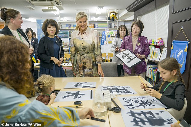 Sophie was photographed engaging with people taking part in a calligraphy language workshop at the Ukraine Mental Health Exchange Center in Tokyo