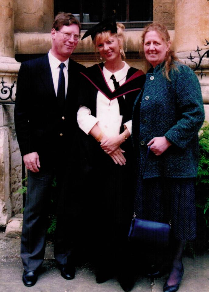 Photo of a family at a graduation ceremony.