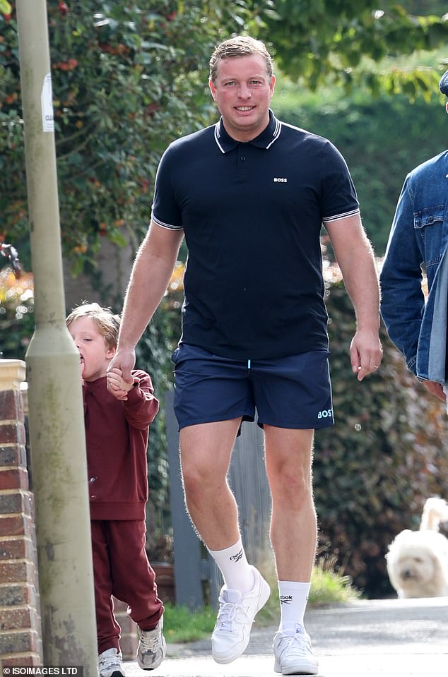 The TV personality, who also shares two-year-old twin daughters Roma and Dalia, with wife Sinéad, slicked back his hair and donned a pair of comfy trainers