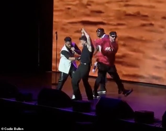 Peter, 52, oozed confidence during his perfomance while I'm A Celeb 's Sam reenacted the song's famous video by lifting his shirt to show off his abs