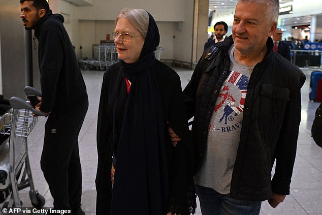 Mrs Reynolds comes through arrivals at Heathrow Airport having flown in from Doha, Qata