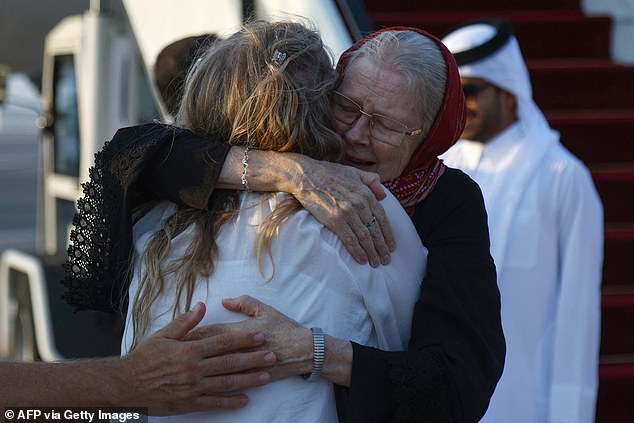 Barbie Reynolds hugs her daughter Sarah Entwistle after landing at the airport in Doha on September 19, 2025