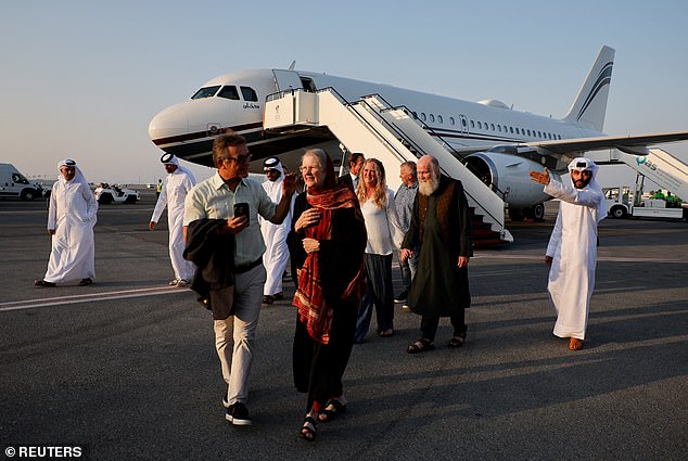 British couple Peter and Barbie Reynolds, who were released from Taliban detention in Afghanistan, walk after disembarking from a plane, in Doha, Qatar, September 19, 2025