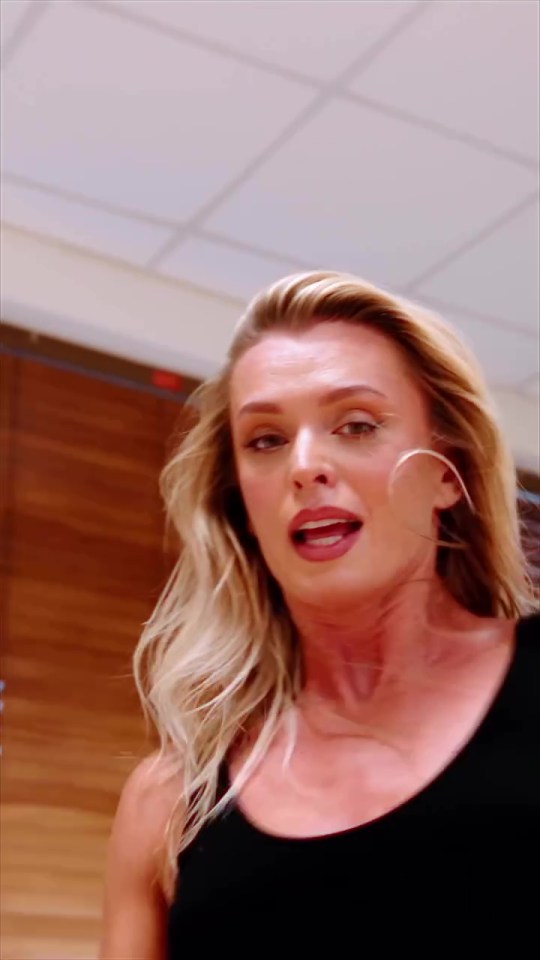 Nadiya Bychkova in a black top with her mouth slightly open.