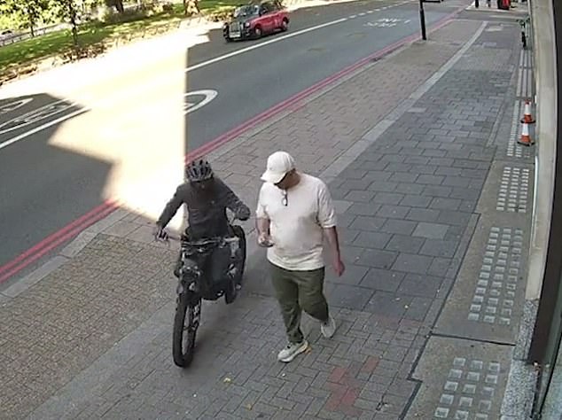 An e-bike rider tries to steal a phone. The Dutch have a word for the plague of riders who defy the speed limits - the Fatbike