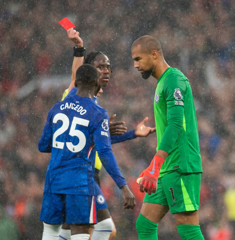 Referee Peter Bankes shows a red card to Robert Sanchez of Chelsea.
