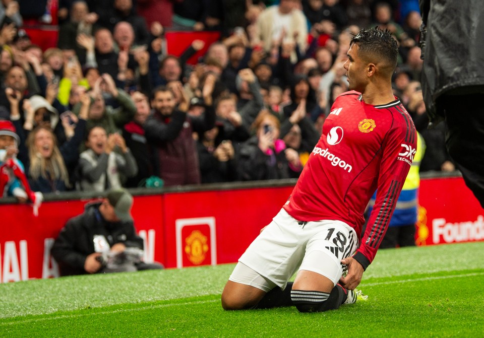 Casemiro of Manchester United celebrates scoring a goal on his knees.