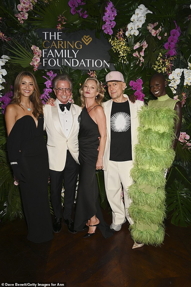 Also in attendance were British artist Marc Quinn, 61, who opted for a smart cream suit, and model Adot Gak, who stunned in a dramatic green ostrich feather gown (L-R Patricia, Richard, Kate, Marc, and Adot)