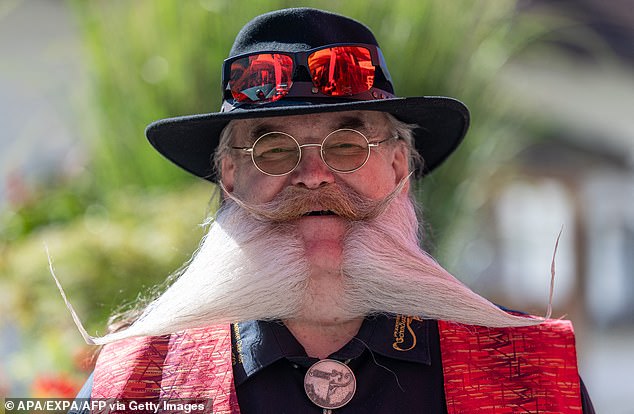 Uwe Hohmall from Germany poses with two sets of glasses with a beard diverging in two directions