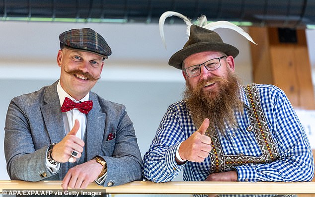 Roland Schartner and Thomas Grundner from Austria pose in colourful attire