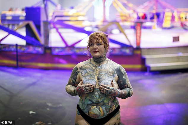 One woman bares all, flashing the flesh to show off the artwork covering the entirety of her torso