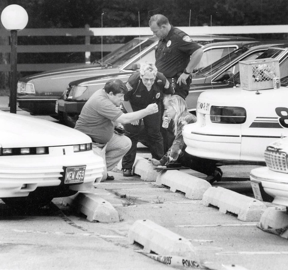 Police investigate the crime scene of Jodi Huisentruit's abduction, focusing on her abandoned shoes near her car.
