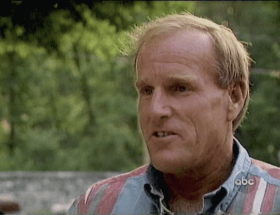 Man in a striped shirt talking.