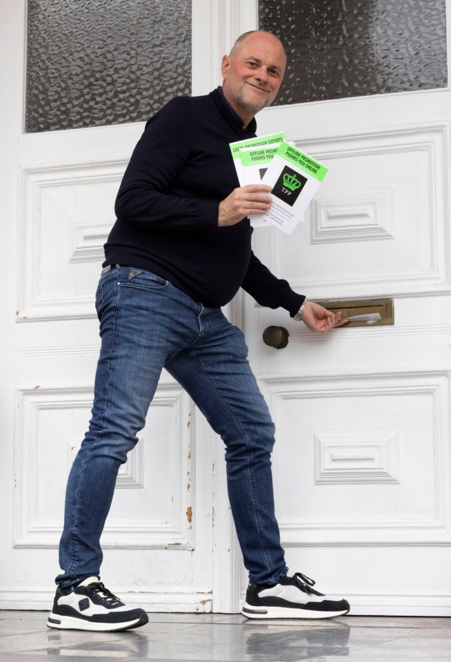 Mark Redmond, founder of TPP, puts a leaflet into a mail slot.