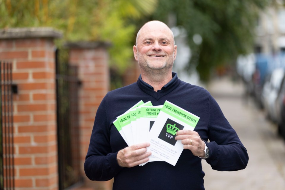 Mark Redmond holding leaflets for "The Private Postman.com" business.