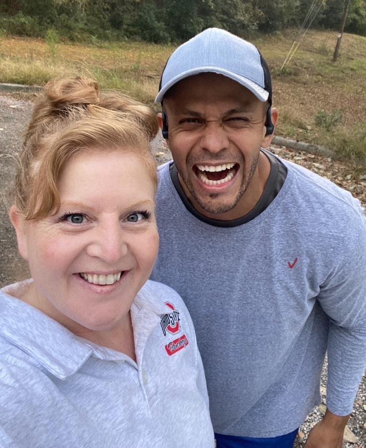 A smiling woman and man posing for a selfie.