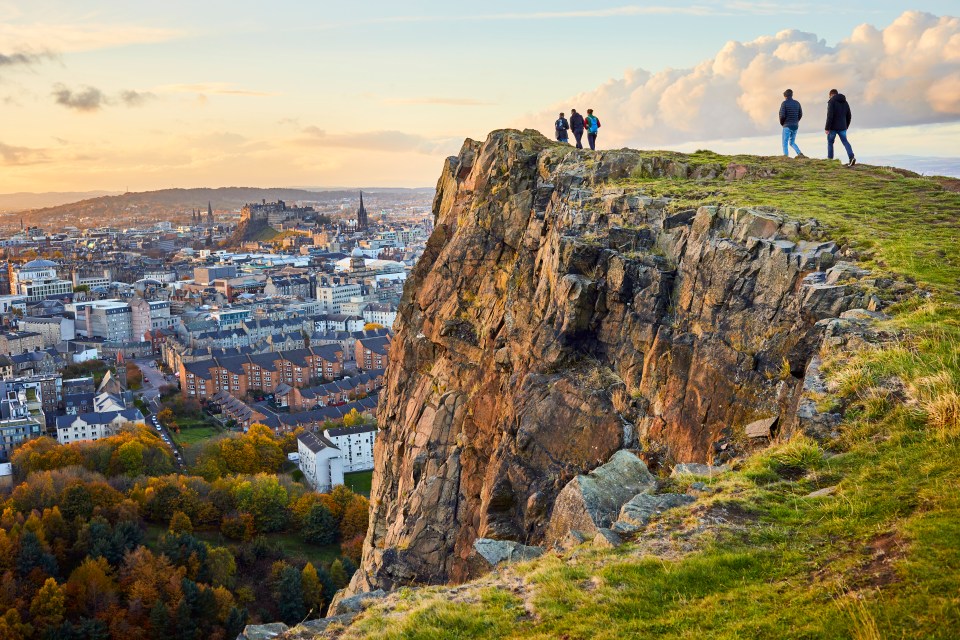 People overlooking Edinburgh from Arthur's Seat.