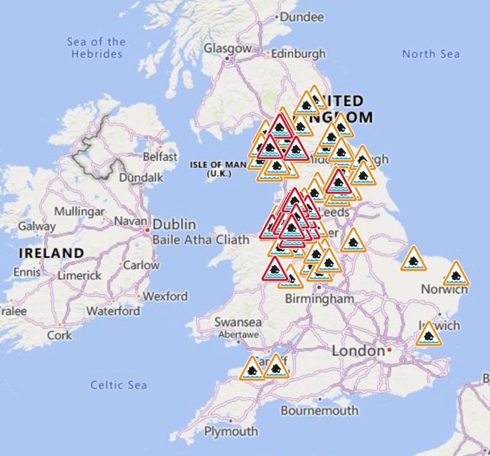 Map of the United Kingdom with numerous flood warning and flood alert symbols.