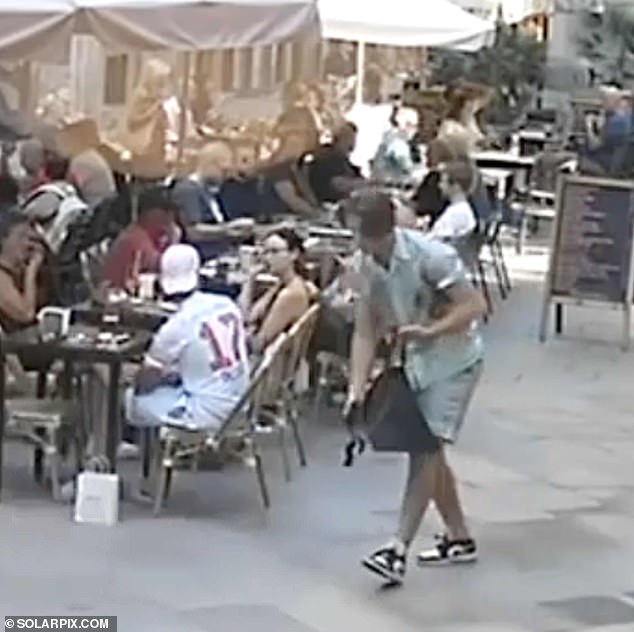 After he was confident his trick had paid off, the thief stooped down to pick up the bag, placed it in another larger holdall he was carrying and calmly walked away
