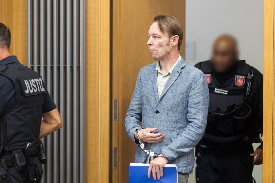 Christian B in handcuffs arriving at court, flanked by guards.
