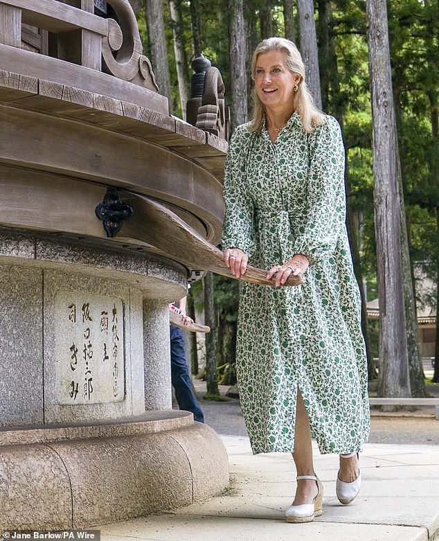Pictured: The Duchess of Edinburgh helps to turn the Rokkaku Kyouzou during a visit to Danjo Garan, one of the two most significant religious sites within Koyasan