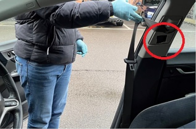 A sock full of cocaine was stuffed in this secret hole (circled) in a drug runner's car