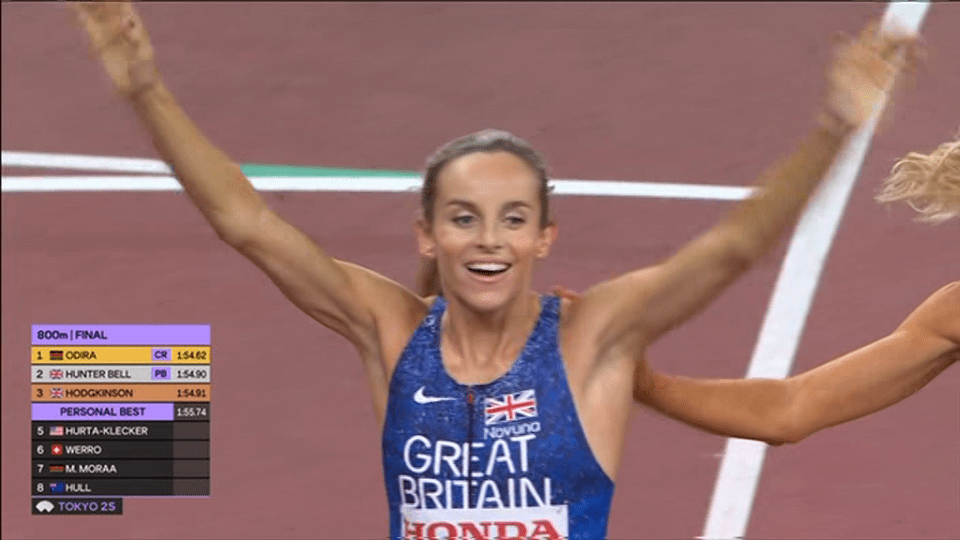 British runner Keeley Hodgkinson finishes the 800m final in second place, celebrating with arms raised.