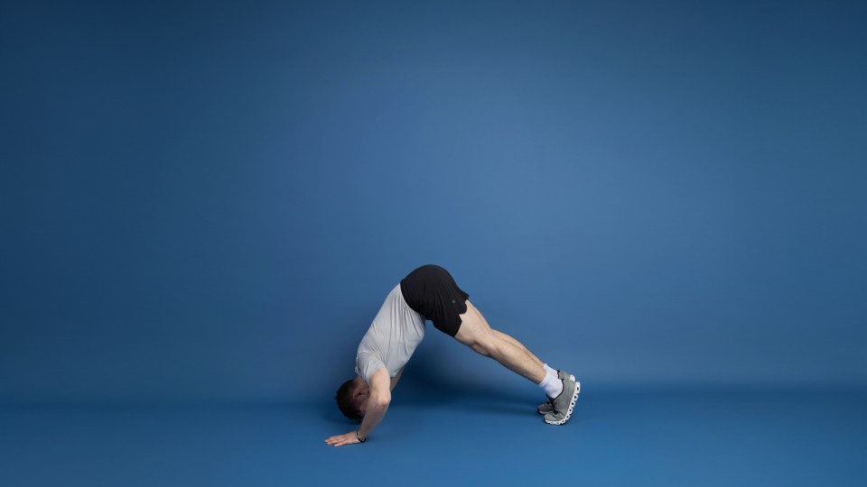 Man performing a pike pushup.