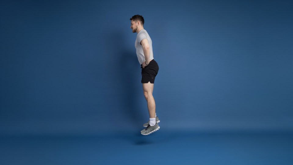 A man in athletic wear jumping in the air.