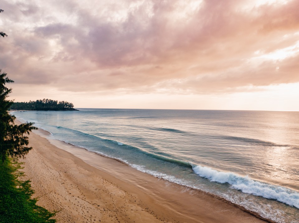 Sunset over Natai Beach in Thailand.