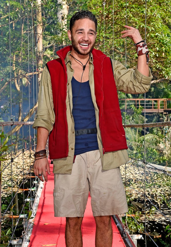 Adam Thomas on a red carpet bridge on "I'm a Celebrity, Get Me Out of Here!"