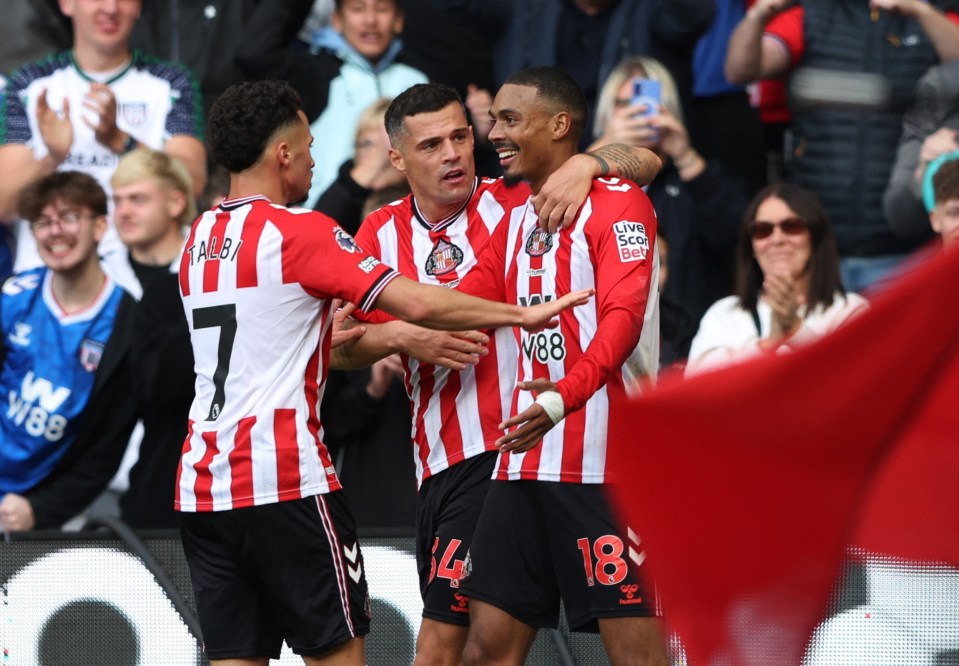 Sunderland's Wilson Isidor celebrates scoring with Granit Xhaka and Chemsdine Talbi.