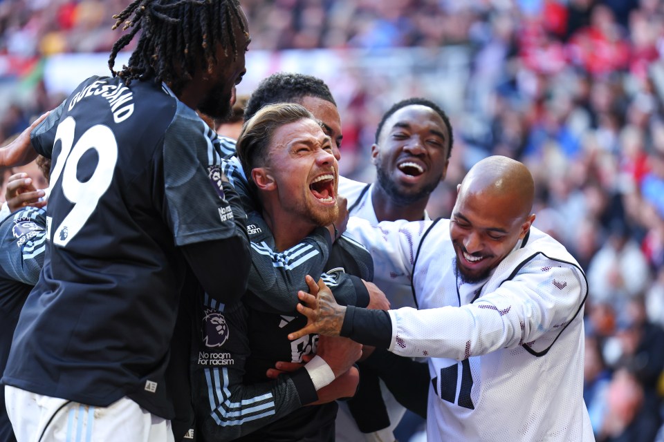 Matty Cash of Aston Villa celebrates a goal with teammates.