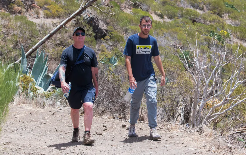 Two men hiking on a sunny day.