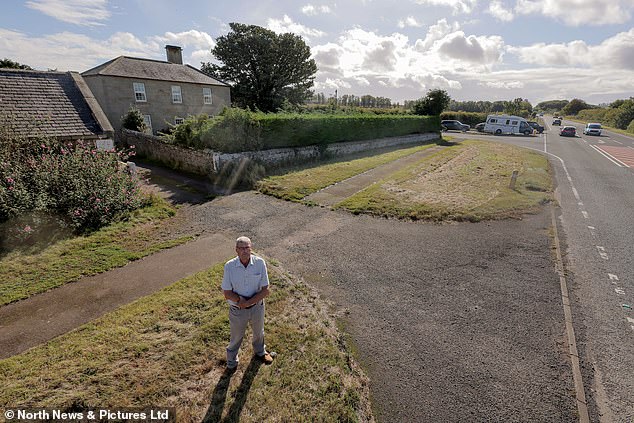 Mr Beal is seen standing by his abandoned farm. He lost his wife to cancer in the upheaval