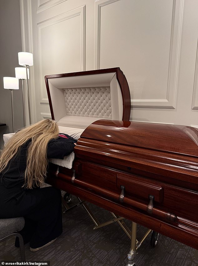 Erika is seen alongside her late husband's casket following his death