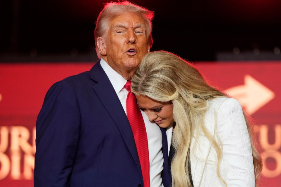 President Donald Trump stands with Erika Kirk at the memorial of her husband, conservative activist Charlie Kirk.
