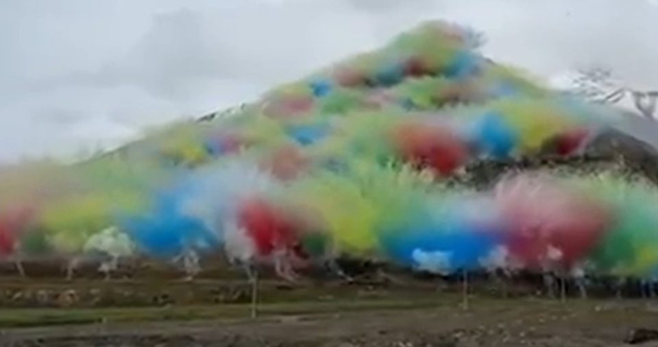 Colorful fireworks exploding on a mountain.