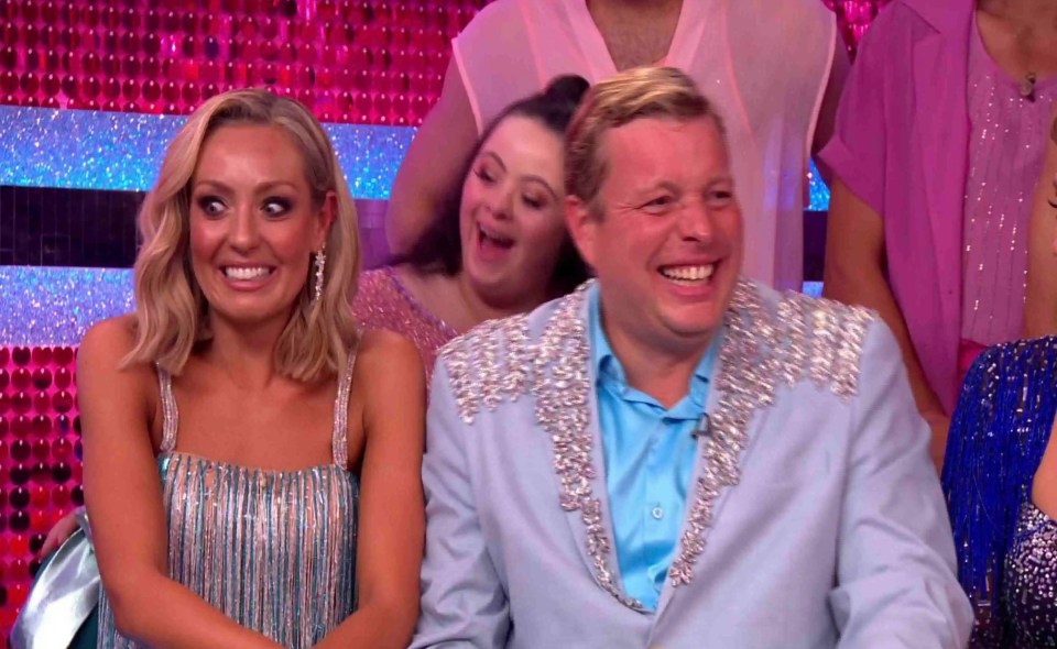 Amy Dowden and Tom Skinner laughing with others at Strictly Come Dancing.