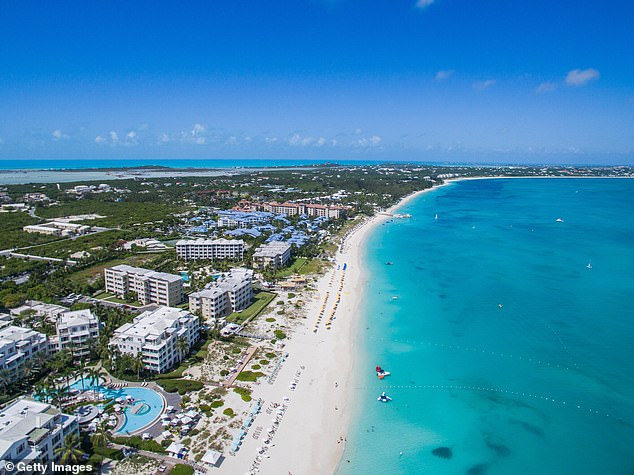 The clear blue sea of Turks and Caicos are seen above. Last year, the island had a record-breaking number of visitors, reaching nearly 2 million