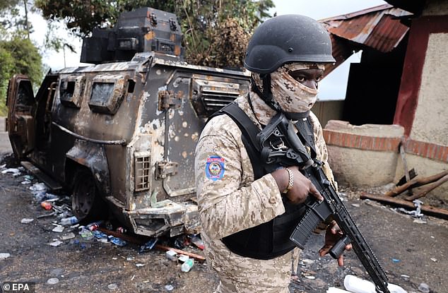 Pictured: A member of the Haitian National Police after an attack by an armed gang in Kenscoff, Haiti, on August 4, 2025. At least eight people, including a three-year-old boy and an Irish missionary, were kidnapped from an orphanage located in an area of upper Port-au-Prince that has been the target of attacks by armed gangs seeking to control it for several months