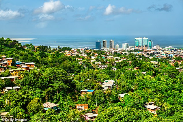 Trinidad and Tobago, the twin islands mere miles from South America, were upgraded in May 2025 to a Level 3 advisory by the State Department, which means Americans are urged to 'reconsider' traveling there (Pictured: Houses overlooking Port of Spain, the capital city)
