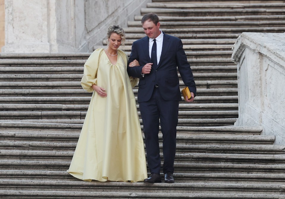 Sepp Straka and wife Paige Dean Straka walking down the Spanish Steps in Rome.