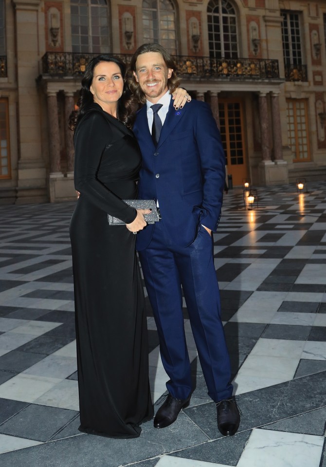 Tommy Fleetwood and wife Clare Fleetwood posing at the Palace of Versailles.