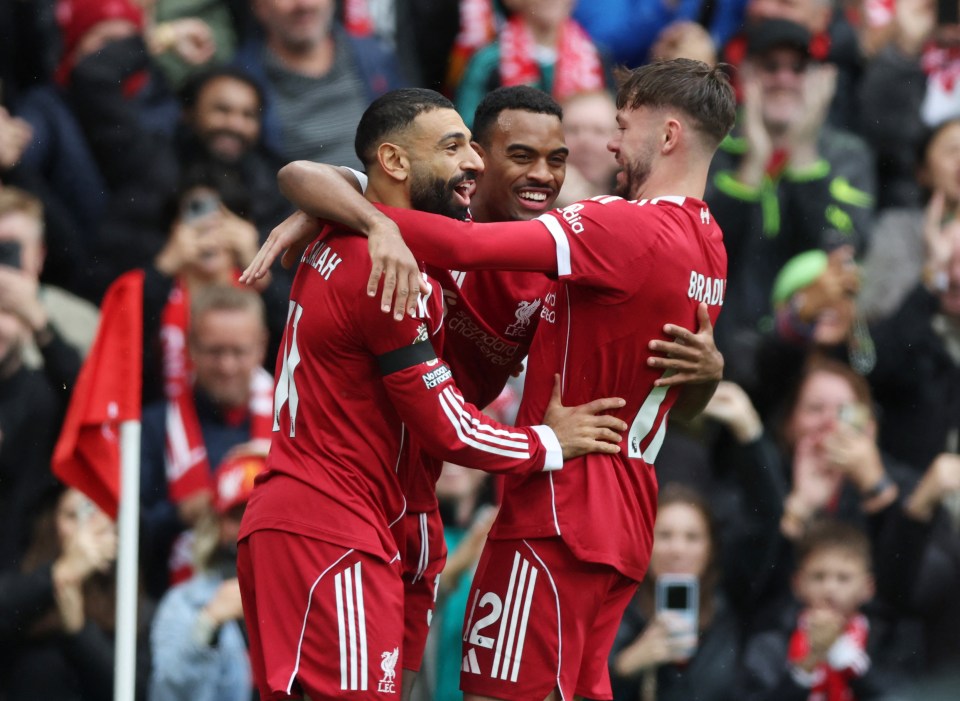 Liverpool's Ryan Gravenberch celebrates scoring with Mohamed Salah and Conor Bradley.
