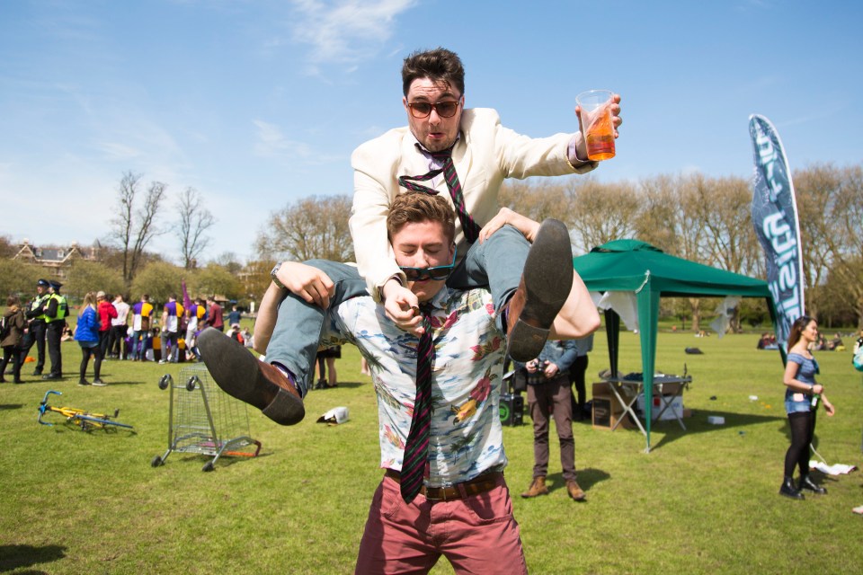 LONDON, UK Caesarian Sunday takes place on Jesus Green in Cambridge on Sunday, May 1st 2016 as thousands of Cambridge University students celebrate the start of the summer term on May bank holiday weekend. The annual event attracts many students in fancy dress, playing traditional drinking games. Photo Credit: Amelia Rabin