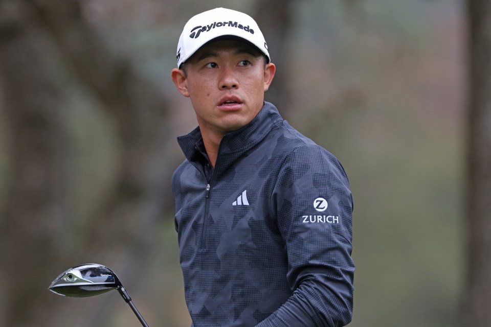 Collin Morikawa of the United States watches his shot from the 12th tee.
